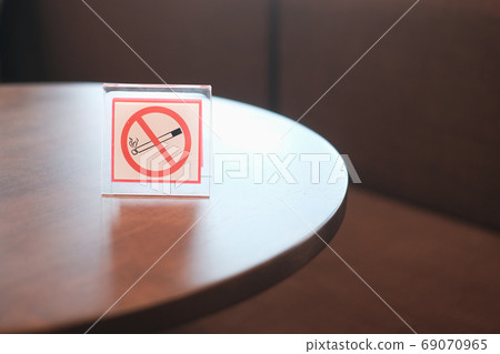 no smoking sign on table with copy space for design... no smoking sign on table with copy space for design... 69070965