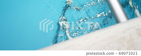 Pool ladder and water ripples Pool ladder and water ripples 69071021