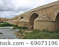 Puente Romano (Spain/Cordoba) in Cordoba's Roman Bridge over the Guadalquivir River 69073196