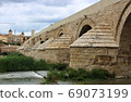 Puente Romano (Spain/Cordoba) in Cordoba's Roman Bridge over the Guadalquivir River 69073199