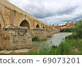Puente Romano (Spain/Cordoba) in Cordoba's Roman Bridge over the Guadalquivir River 69073201
