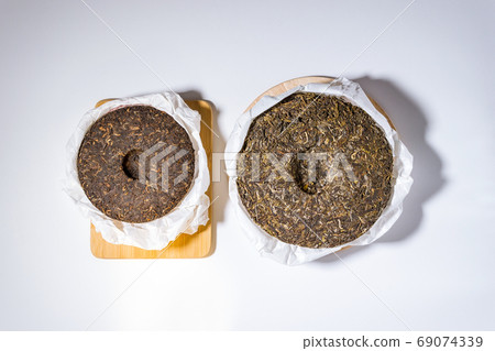 Chinese Tea Shu Shen Puer. Close-up. Pressed Tea. top view flat lay 69074339