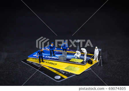 Miniature people : Police And Detective finding proof from credit card in crime scene Miniature people : Police And Detective finding proof from credit card in crime scene 69074805