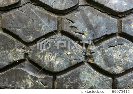 texture of an old car tire wheel. close up macro 69075415
