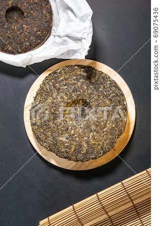 pressed puer tea top view. Chinese puer shu and shen in the form of pancakes. top view, vertical photo pressed puer tea top view. Chinese puer shu and shen in the form of pancakes. top view, vertical photo 69075436