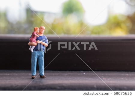 Miniature people : Parents with children walking outdoor , Happy family concept 69075636