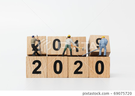 Miniature people : Worker team create wooden block number 2020 , Happy new year concept Miniature people : Worker team create wooden block number 2020 , Happy new year concept 69075720
