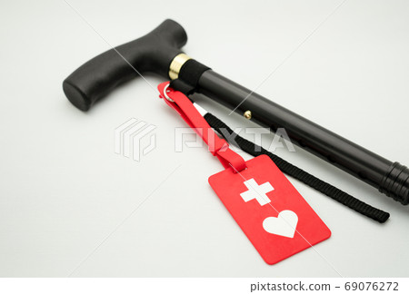 Cane and help mark on white background Cane and help mark on white background 69076272