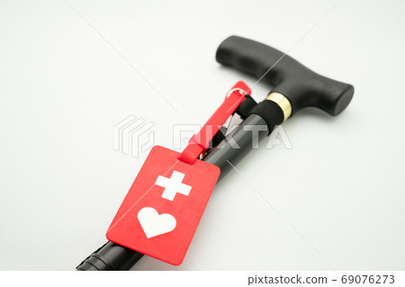 Cane and help mark on white background 69076273