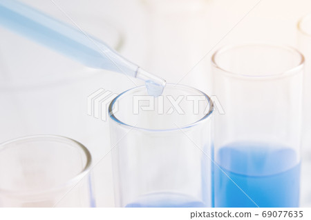 to test tube. medical research concept. closed up and selective focus to test tube. medical research concept. closed up and selective focus 69077635