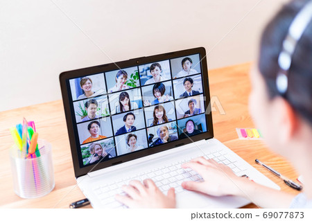 Young female employee attending an online meeting 69077873