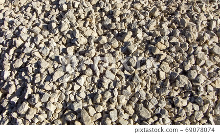 Modern gravel texture. Small stones, little rocks, pebbles in many shades of grey Modern gravel texture. Small stones, little rocks, pebbles in many shades of grey 69078074