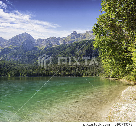 View of lake Tovel, coastline and mountains View of lake Tovel, coastline and mountains 69078075
