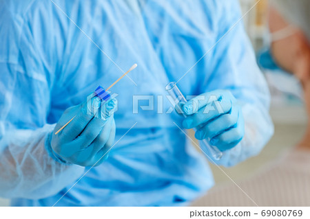 Medical Worker Holding Swab Test Stick Medical Worker Holding Swab Test Stick 69080769
