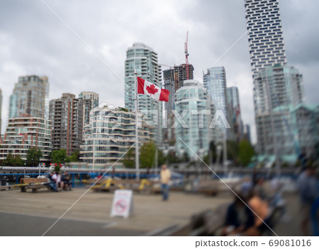 A photograph of the surroundings blurred around the Canadian flag using a tilt lens Vancouver Vancouver British Columbia A photograph of the surroundings blurred around the Canadian flag using a tilt lens Vancouver Vancouver British Columbia 69081016