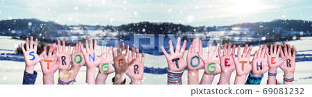 Children Hands Building Word Stronger Together, Snowy Winter Background 69081232