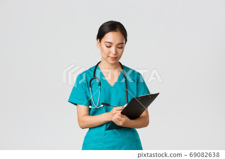 Healthcare workers, preventing virus, quarantine campaign concept. Serious-looking professional female doctor, nurse in scrubs writing down info on clipboard, examine patient, white background 69082638