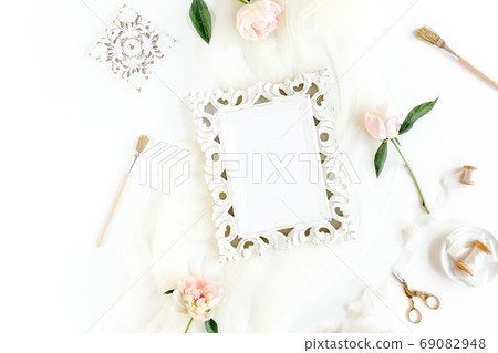 Gold frame decorated of beautiful beige peonies. Flat lay, top view. Valentine's background. Floral frame. Peony texture. Gold frame decorated of beautiful beige peonies. Flat lay, top view. Valentine's background. Floral frame. Peony texture. 69082948
