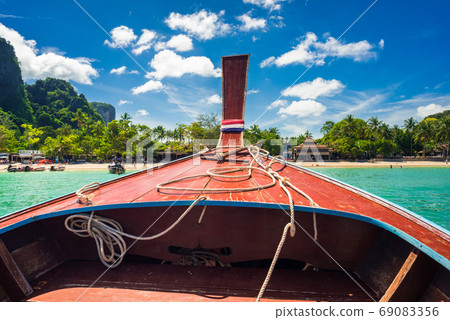 Traveling by long tail boat to Railay Beach, Krabi. Vacation in Thailand Traveling by long tail boat to Railay Beach, Krabi. Vacation in Thailand 69083356