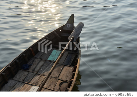 A ferry boat, a wooden retro boat, suspended at Dhaka Shodorgat, Bangladesh 69083693