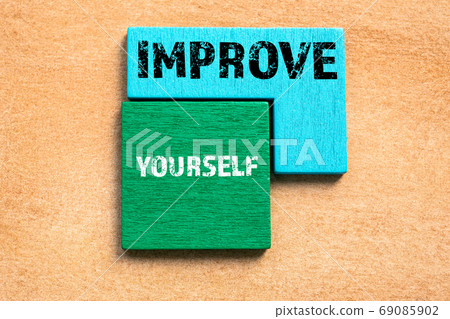 IMPROVE YOURSELF. Colored wooden blocks, puzzle and mind game IMPROVE YOURSELF. Colored wooden blocks, puzzle and mind game 69085902