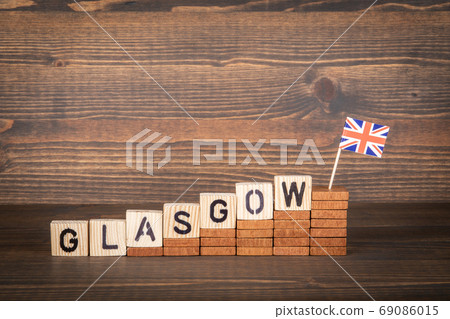 GLASGOW. City in Great Britain. Steps and flag on a wooden background 69086015