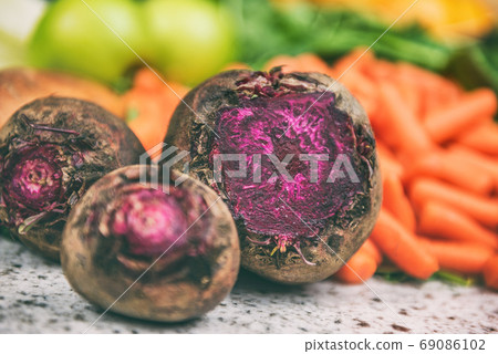 Beets and carrots vegetables harvest background Beets and carrots vegetables harvest background 69086102
