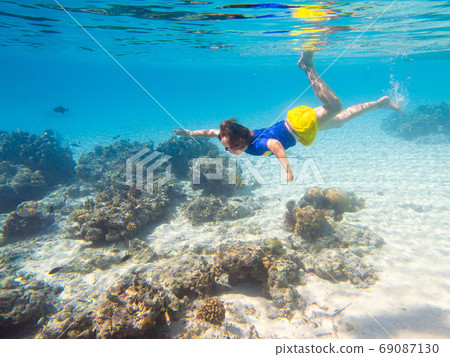 Child snorkeling. Kids underwater. Beach and sea. Child snorkeling. Kids underwater. Beach and sea. 69087130