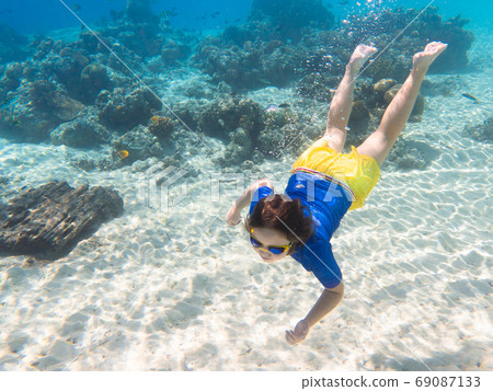 Child snorkeling. Kids underwater. Beach and sea. 69087133