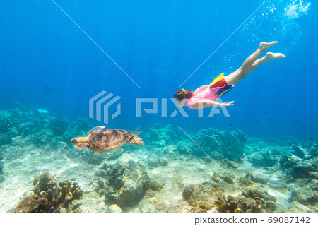 Child snorkeling. Kids underwater. Beach and sea. Child snorkeling. Kids underwater. Beach and sea. 69087142