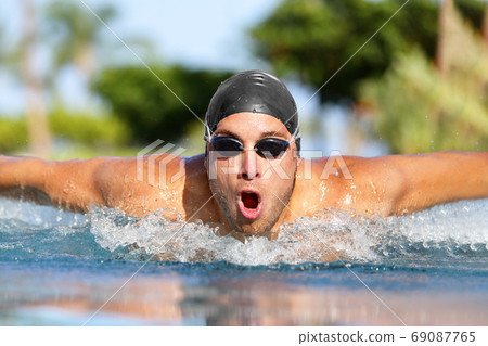Fit swimmer sport athlete man swimming Fit swimmer sport athlete man swimming 69087765
