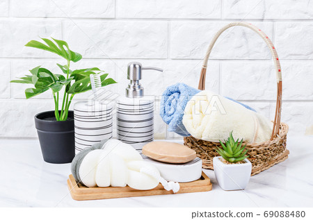 Herb soap, shower sponge and shampoo pump bottle. 69088480