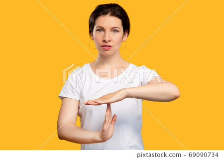 time out gesture need break tired woman on orange time out gesture need break tired woman on orange 69090734