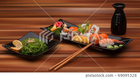 sushi on a black plate 69095328