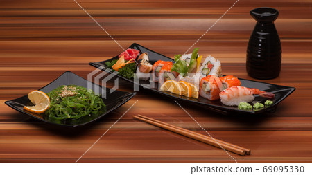 sushi on a black plate 69095330