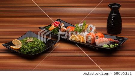 sushi on a black plate sushi on a black plate 69095331
