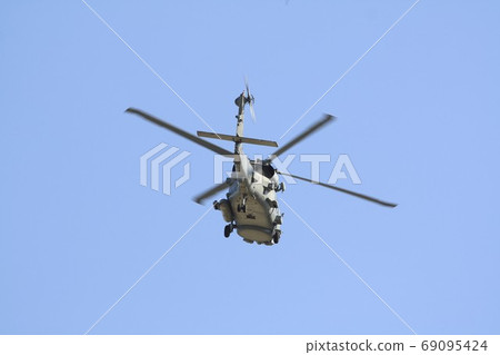 U.S. Navy aircraft carrier MH-60R Seahawk patrol helicopter also active in rescue operations while flying in the blue sky U.S. Navy aircraft carrier MH-60R Seahawk patrol helicopter also active in rescue operations while flying in the blue sky 69095424