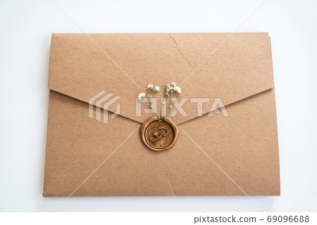 Envelope with wax seal and little dry flowers Envelope with wax seal and little dry flowers 69096688