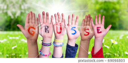 Children Hands Building Word Gruesse Means Greetings, Grass Meadow 69098803