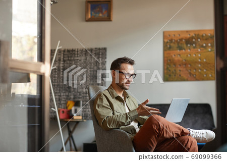 Man using laptop Man using laptop 69099366