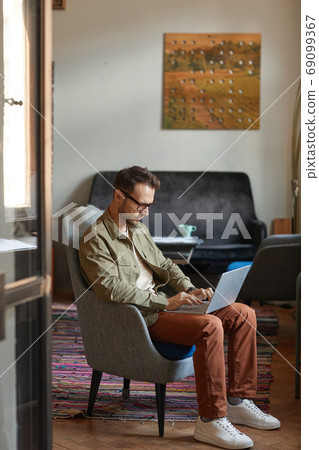Man working on laptop Man working on laptop 69099367