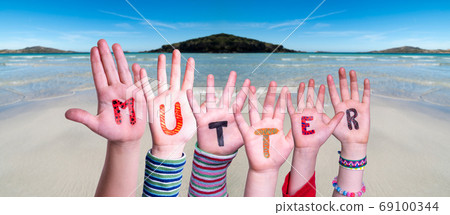 Children Hands Building Word Mutter Means Mother, Ocean Background 69100344
