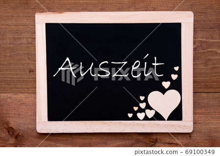 Balckboard With Wooden Heart Decoration, Text Auszeit Means Downtime Balckboard With Wooden Heart Decoration, Text Auszeit Means Downtime 69100349