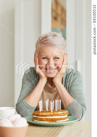 Senior woman with cake Senior woman with cake 69100532