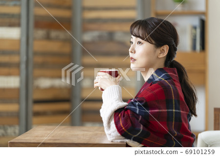 A young lady with a mug A young lady with a mug 69101259