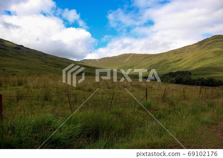 Hillsides and Wire Fence in Scottish Highlands 69102176