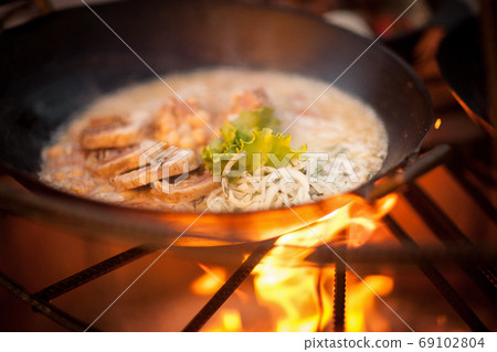 cooking on fire cooking on fire 69102804