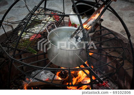 cooking on fire cooking on fire 69102806
