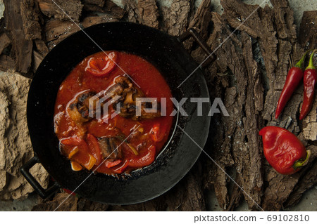 dish on a tree bark dish on a tree bark 69102810