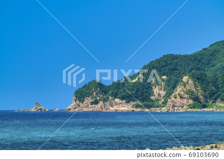 Clear Sasakawa stream and blue sea Murakami city, Niigata prefecture 69103690